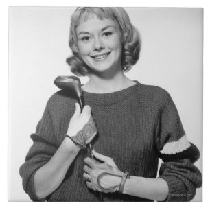 Frau mit Golfschläger Fliese