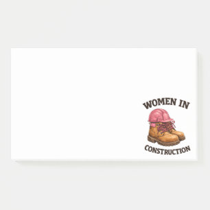 Frauen in Bauarbeitsstiefeln und Schutzhelm Post-it Klebezettel
