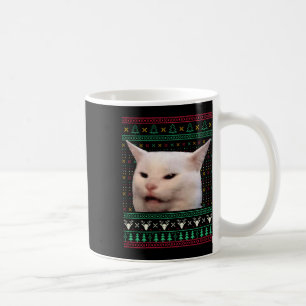 Frauen schreien bei einer Katze, die zu Weihnachte Kaffeetasse
