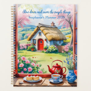 Friedliche Hütte mit Tee und Blume Planer