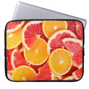 Frische reife Orange und Grapefruit Hintergrund Laptopschutzhülle