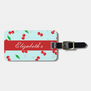 Frische rosa Kirschen auf einem tadellosen Gepäckanhänger