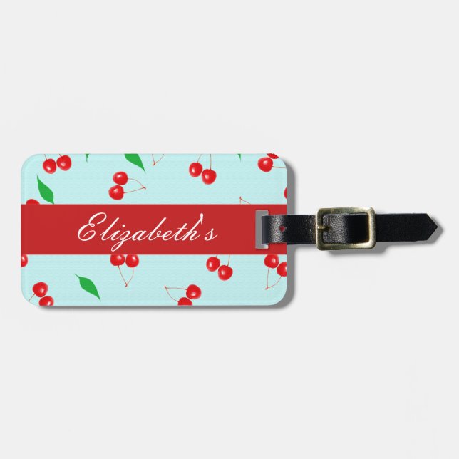 Frische rosa Kirschen auf einem tadellosen Gepäckanhänger (Vorderseite horizontal)