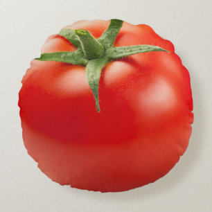 Frische rote Tomate abgeschieden auf weißem Rundes Kissen