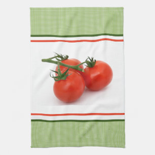 Frische Tomaten am Weinstock in der grünen Küche Geschirrtuch