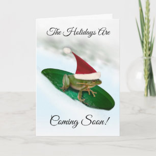 Frog sträubt sich durch den Schnee Weihnachten