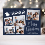 Frohe Weihnachten 5 Foto Santa Sleigh Blue<br><div class="desc">Eine festlich blaue Urlaubskarte mit einer 5-Foto-Collage verstreuter Bilder in weißen Rahmen,  eine weiße Silhouette von Rentieren,  die den Schlitten des Weihnachtsmanns fliegen,  "Frohe Weihnachten" in einem stilvollen weißen Drehbuch und Ihren Namen in schlichter,  moderner Weißtypografie.</div>