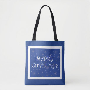 Frohe Weihnachten auf Blau mit Schneeflocken