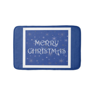 Frohe Weihnachten auf Blau mit Schneeflocken Badematte