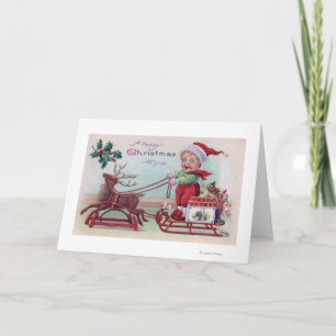 Frohe Weihnachten für YouBoy auf einem Schlitten