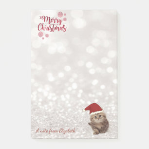 Frohe Weihnachten,Glitzernder Bokeh ,Katze mit Wei Post-it Klebezettel