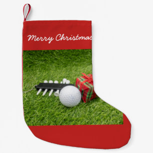 Frohe Weihnachten mit Golf und Geschenk auf Grün Kleiner Weihnachtsstrumpf
