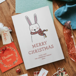 Frohe Weihnachten. Niedliches Winterhasen-Tier Feiertagskarte