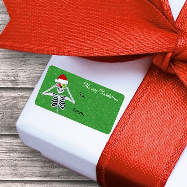 Frohe Weihnachten Skeleton Ornament Augen Grün Gol Adressaufkleber (Christmas skeleton ornament eyes Santa hat on green gift tag sticker label.)
