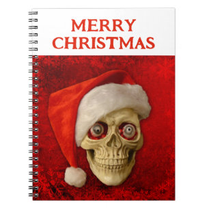 Frohe Weihnachten. Totenkopf mit Santa Hut Notizblock
