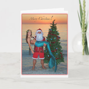 Frohe Weihnachts-Meerjungfrau mit Santa am Strand Feiertagskarte