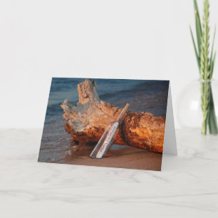 Frohe Weihnachtsbotschaft in einer Flasche Feiertagskarte