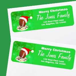 Frohe Weihnachtsfußball mit Weihnachtsmannmütze un