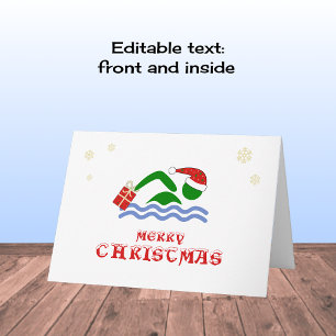 Frohe Weihnachtsschwimmer bringen Geschenk Feiertagskarte
