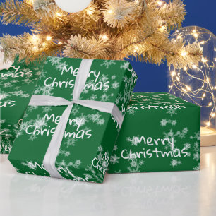 Frohe Weihnachtstext in Schneeflocken Geschenkpapier