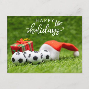 Froher Fußballurlaub mit Weihnachtsmannmütze Weihn Feiertagspostkarte