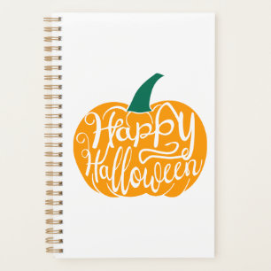Fröhliche Halloween-Schrift auf geschnitztem Kürbi Planer