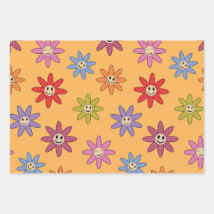 Fröhliche lächelnde bunte Blumen auf orange  Geschenkpapier Set