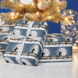 Fröhliche Weihnachtskatzen auf einem Winterzaun Geschenkpapier