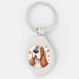 Fröhlicher Basset-Hund mit orangen Pfotenabdrücken Schlüsselanhänger