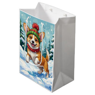 Fröhlicher Corgi-Hund springt im Schnee mit Pom-Po Mittlere Geschenktüte