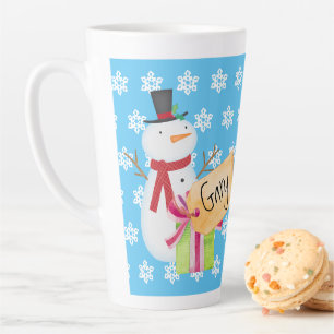 Fröhlicher Schneemann mit einem Weihnachtsgeschenk Milchtasse