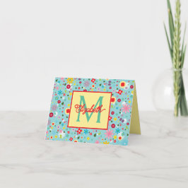 Frühlingsblumen auf aquablauem Monogramm