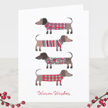 Fun Dackel Dog Feiertagskarte<br><div class="desc">Adorable kleine Dackel,  Dackel oder Würstchen Hunde in gemütlichen Winterstrickmode. Ändern Sie den Gruß auf der Vorderseite und innen und auch die Namen zu personalisieren. Originelle Kunst von Nic Squirrell.</div>