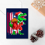 Funny Blue Christmas Santa TRex Tyrannosaurus Xmas Feiertagskarte<br><div class="desc">Suchen Sie ein einzigartiges und lustiges T-Rex Design? Schauen Sie sich unsere Funny Blue Weihnachten Weihnachten Weihnachten Rex Tyrannosaurus Weihnachten Weihnachtskarte an! Ideal für jeden, der Dinosaurier und Vintage Designs Liebe. Es verfügt über einen Tyrannosaurus Rex und die amerikanische Flagge. Diese Tyrannosaurus Rex Weihnachtskarte ist eine großartige Weihnachtsgeschenkidee für alle,...</div>