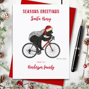 Funny Christmas Honey Badger auf einem Fahrrad Cus Feiertagspostkarte