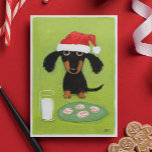 Funny Dachshund Dog Santa with Milk and Cookies Feiertagskarte<br><div class="desc">Funny art illustration of a black and tan Dachshund wearing a Santa hat and sitting in front of a glass of milk and a plate of frosted holiday cookies. "Merriest Christmas Wishes." This text can be personalized with your own custom greeting. A perfekt holiday card for pet services to customize...</div>