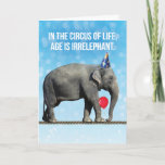 Funny Elephant Foto - Zeitalter ist irrelevant Geb Karte<br><div class="desc">Das sonnige Foto eines Elefanten,  der einen Party-Hut trägt,  einen Ballon mit seinem Stamm hält und auf einem dichten Seil spaziert. Im Zirkus des Lebens ist das Alter irrelevant,  es sei denn,  Sie sind auf einem dichten Seil,  dann hilft es,  jung zu sein. Also wahr!</div>