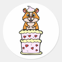 Funny Hamster springt aus einem Kuchen