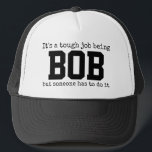Funny Trendy Name ist ein harter Job Bob Truckerkappe<br><div class="desc">Dieses lustige Design zeigt die Worte: "Es ist eine schwierige Aufgabe, BOB zu sein, aber jemand muss es tun." Sie können die Wörter zu dem ändern, was Sie wollen. Wenn Sie Hilfe bei der Anpassung benötigen, schreiben Sie mir bitte eine E-Mail an gmail.com. Weitere einzigartige Artikel finden Sie in unserem...</div>
