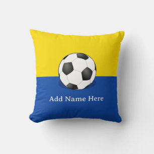Fußball auf gelbem und blauem Hintergrund Kissen