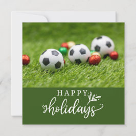 Fußball-Happy Holidays mit Ball auf grünem Gras Feiertagskarte