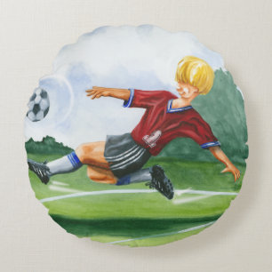 Fußball-Spieler, der einen Ball durch Jay Rundes Kissen