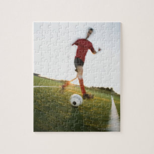 Fußball-Spieler treibende Kugel Puzzle