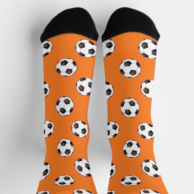 Fußbälle auf orangefarbenen Socken (Oben)