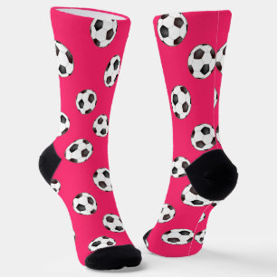 Fußbälle auf rosa Socken
