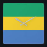 Gabon Flag Quadratische Wanduhr<br><div class="desc">Die gabunische Flagge ist ein horizontales Triband. Die verwendeten Farben in der Flagge sind blau,  grün,  gelb. Der Anteil der gabunischen Flagge beträgt 3:4. Die Flagge Gabuns wurde 1960 adoptiert.</div>