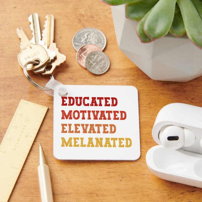 Gebildete motivierte, aufgereifte, melanierte Lehr Schlüsselanhänger (Schreibtisch)