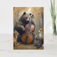 Geburtstagsbär, der im Herbstwald Cello spielt