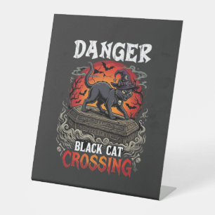 Gefahr Schwarze Katze überquert Halloween Hexenhut Sockelschild