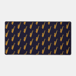 Gelb-orangefarbene Saxophone und schwarzer Hinterg Schreibtischunterlage